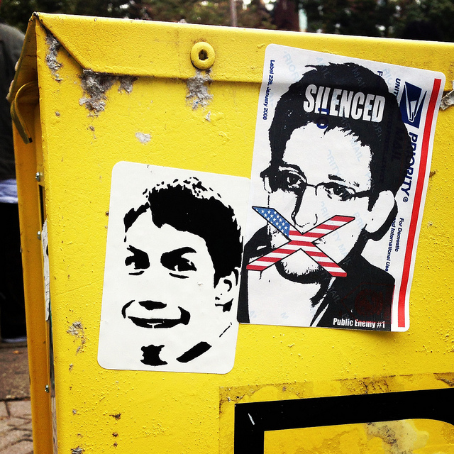 An anonymous artist's portrait of Edward Snowden, next to a Borf sticker. Photo by RJ Rushmore.